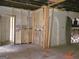 Renovation in progress showing a large kitchen space with original tile and new framing at 2004 Joseph E Boone Nw Blvd, Atlanta, GA 30314