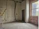 Unfinished living room with exposed framing and doorway at 2004 Joseph E Boone Nw Blvd, Atlanta, GA 30314