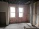 Unfinished living room with exposed framing and windows at 2004 Joseph E Boone Nw Blvd, Atlanta, GA 30314