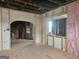 Renovation in progress, showing an open living area with exposed brick walls and large windows at 2004 Joseph E Boone Nw Blvd, Atlanta, GA 30314