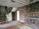 Unfinished living room with exposed brick and a fireplace at 2004 Joseph E Boone Nw Blvd, Atlanta, GA 30314