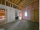 Unfinished living room with hardwood floors and fireplace at 2004 Joseph E Boone Nw Blvd, Atlanta, GA 30314