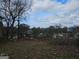 Vacant lot with some debris, view of street and houses at 2004 Joseph E Boone Nw Blvd, Atlanta, GA 30314