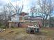 Under construction home with brick exterior and dumpster at 2004 Joseph E Boone Nw Blvd, Atlanta, GA 30314