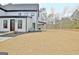 Side view of the house showcasing the modern design and backyard at 115 Grace Hope Dr, Brooks, GA 30205