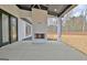 Covered patio with an outdoor fireplace and a view of the backyard at 115 Grace Hope Dr, Brooks, GA 30205