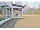 Covered patio with fireplace and ceiling fan at 115 Grace Hope Dr, Brooks, GA 30205