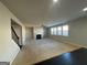 Bright living room with a fireplace and lots of natural light at 566 Mariposa Ln, Mcdonough, GA 30253