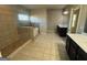 Main bathroom featuring dual vanities, separate shower and tub at 566 Mariposa Ln, Mcdonough, GA 30253