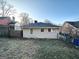 Large backyard with grass and a view of a neighboring home at 555 Holly Nw St, Atlanta, GA 30318