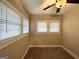 Well-lit bedroom with neutral carpeting and multiple windows at 555 Holly Nw St, Atlanta, GA 30318