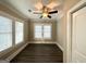 Bright bedroom with hardwood floors and two windows with blinds at 555 Holly Nw St, Atlanta, GA 30318