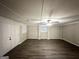 Spacious basement with exposed brick and vinyl flooring at 1908 Delowe Sw Pl, Atlanta, GA 30311