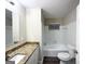 Bathroom with granite countertop, bathtub and shower at 1908 Delowe Sw Pl, Atlanta, GA 30311