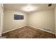 Simple bedroom with neutral walls and carpeted floors at 1908 Delowe Sw Pl, Atlanta, GA 30311