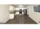 Renovated kitchen with granite countertops and stainless steel appliances at 1908 Delowe Sw Pl, Atlanta, GA 30311