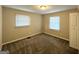 Simple bedroom with gray carpet, window, and closet at 3809 Clovis Nw Ct, Atlanta, GA 30331