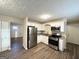 Renovated kitchen with stainless steel appliances and white cabinets at 3809 Clovis Nw Ct, Atlanta, GA 30331