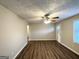 Spacious living room featuring wood-look floors and a ceiling fan at 3809 Clovis Nw Ct, Atlanta, GA 30331
