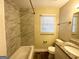 Updated bathroom with granite vanity and tiled shower/tub at 757 Alfred Nw Rd, Atlanta, GA 30331