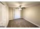 Spacious bedroom with carpet, ceiling fan and window at 757 Alfred Nw Rd, Atlanta, GA 30331
