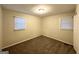 Bright bedroom with carpet and two windows at 757 Alfred Nw Rd, Atlanta, GA 30331
