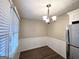Cozy dining area with a chandelier and window view at 757 Alfred Nw Rd, Atlanta, GA 30331