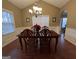 Elegant dining room featuring a wood table and chairs at 430 Creekwood Pass, Dallas, GA 30157