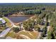 Aerial view of lake with walking paths and trees at 8555 Spivey Village Trl, Jonesboro, GA 30236