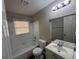 Clean bathroom with bathtub, sink, and mirror at 6584 Port A Prince Dr, Forest Park, GA 30297