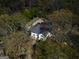 Aerial view of white house nestled in the woods at 2095 Sw Flat Shoals Rd, Conyers, GA 30094