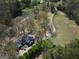 Aerial view of house, driveway, and large yard at 2095 Sw Flat Shoals Rd, Conyers, GA 30094