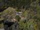 Aerial view of house, pond, and wooded area at 2095 Sw Flat Shoals Rd, Conyers, GA 30094