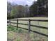 Wooden fence encloses grassy backyard at 2095 Sw Flat Shoals Rd, Conyers, GA 30094