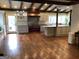 Open kitchen with hardwood floors and exposed beams at 2095 Sw Flat Shoals Rd, Conyers, GA 30094