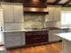 Modern kitchen with range and custom cabinetry at 2095 Sw Flat Shoals Rd, Conyers, GA 30094