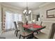 Formal dining room with table, chairs, and elegant window treatments at 365 Pendleton Trl, Tyrone, GA 30290