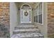 Stone steps leading to front door with wreath at 365 Pendleton Trl, Tyrone, GA 30290