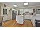Spacious kitchen with white cabinets, stainless steel appliances, and an island at 365 Pendleton Trl, Tyrone, GA 30290