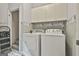 Laundry room with washer, dryer, and cabinets for storage at 365 Pendleton Trl, Tyrone, GA 30290