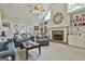 Comfortable living room with fireplace, built-ins and hardwood floors at 365 Pendleton Trl, Tyrone, GA 30290