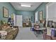 Home office with desk, seating area, and collectibles at 365 Pendleton Trl, Tyrone, GA 30290
