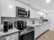 Well-equipped basement kitchenette featuring stainless steel appliances at 65 Pates Lake Way, Hampton, GA 30228