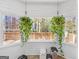 Kitchen breakfast nook with wood-look flooring and view of backyard deck at 65 Pates Lake Way, Hampton, GA 30228