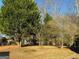 Spacious backyard with mature trees and landscaping at 4756 Manly, Stone Mountain, GA 30088