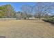 Large backyard with grassy area and wooden fence at 100 Roxbrough Ln, Fayetteville, GA 30215