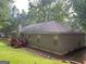 House back, yard, and partial side view at 50 Riverside Ct, Hampton, GA 30228