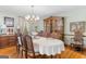 Formal dining room with hardwood floors and chandelier at 1431 Chambers Rd, Mcdonough, GA 30253