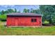 Red barn in wooded area at 1600 E Highway 81, Mcdonough, GA 30252