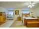 Cozy bedroom with wooden furniture and large windows at 1600 E Highway 81, Mcdonough, GA 30252